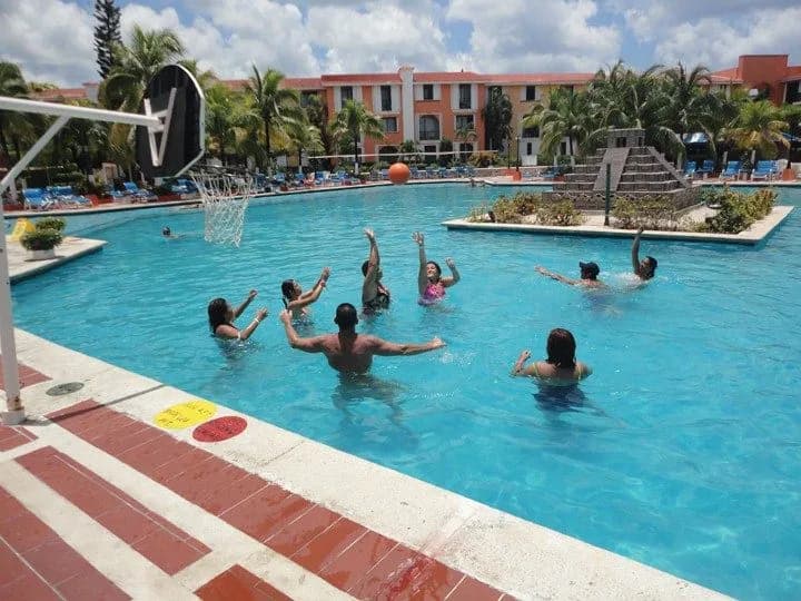 People having a blast playing in the pool at the Cozumel Palace resort! People having a blast playing in the pool at the Cozumel Palace resort!