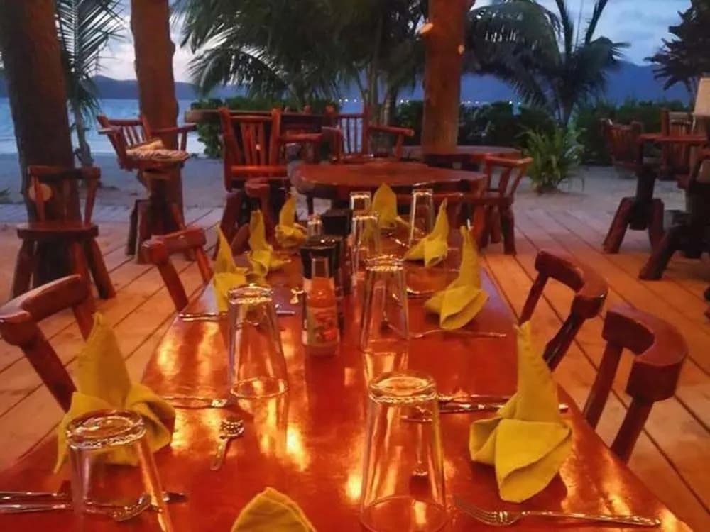 A table set for dinner at Cabañas on Clark’s Cay in Honduras. A table set for dinner at Cabañas on Clark’s Cay in Honduras.