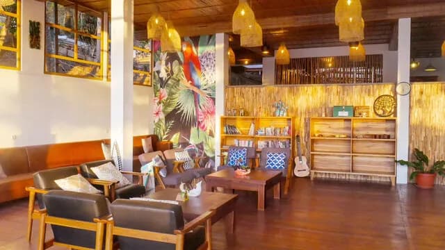 A sitting area with chairs and tables A sitting area with chairs and tables