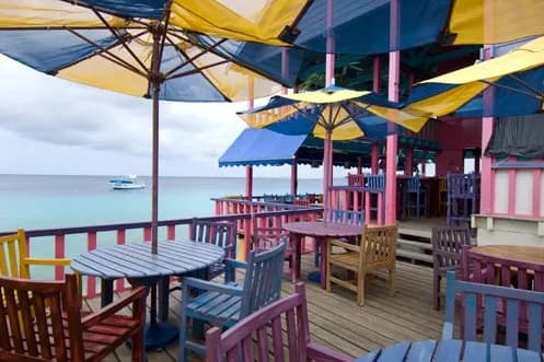 Shaded sun deck with chair and tables Shaded sun deck with chair and tables