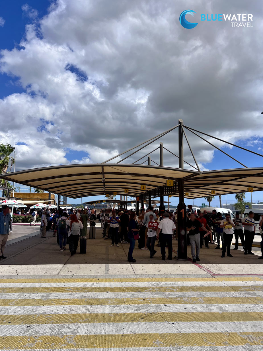 Drivers wait under a canopy at the Cabo Airport SJD