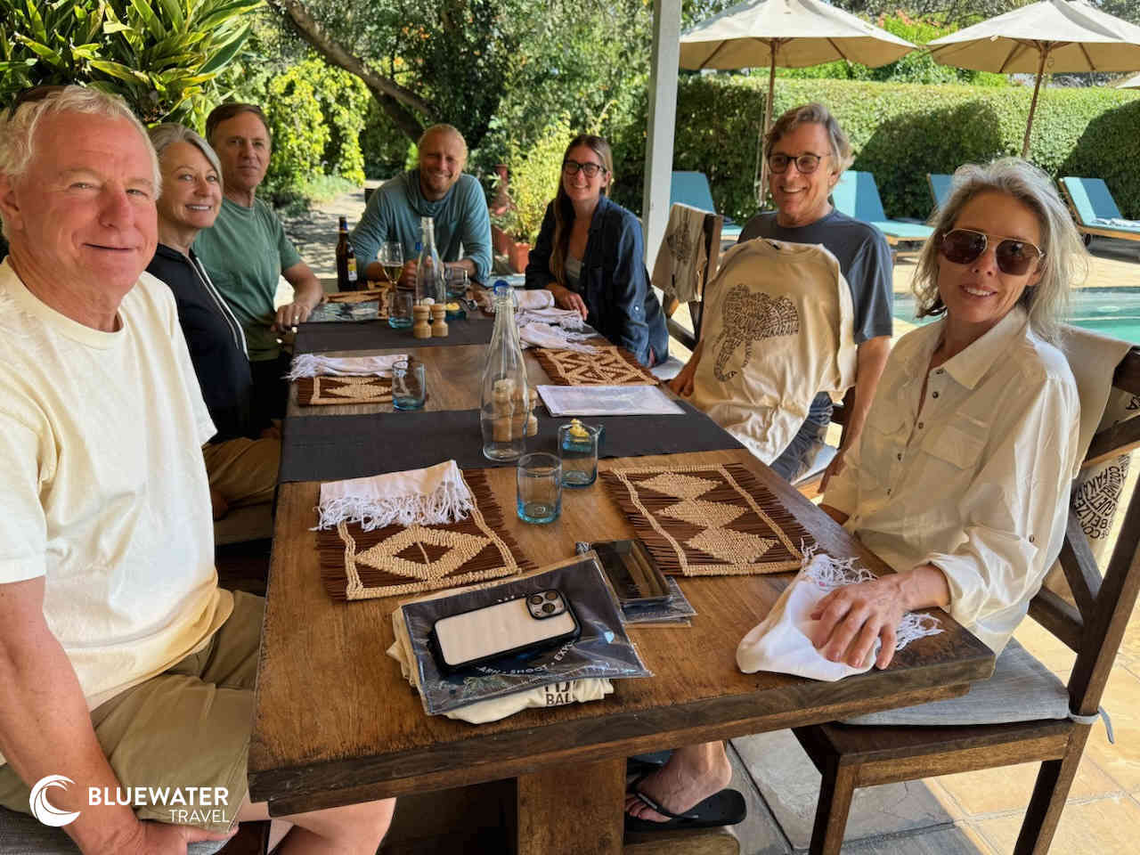 Guests gather around the dining table for a photo