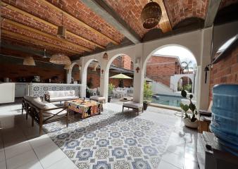 Buceo Carey lobby with couches and tables for guests