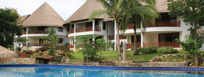  Building exteriors and a swimming pool at Amun Ini Beach Resort and Spa