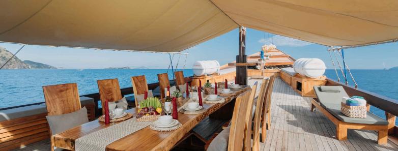 Outdoor dining area on shaded deck