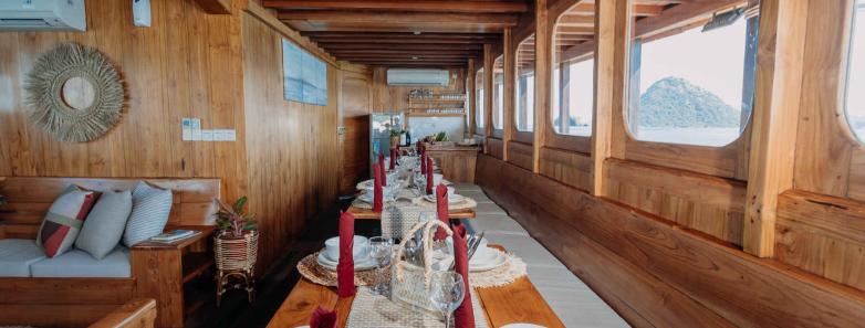 Indoor dining area set up with plates and utensils