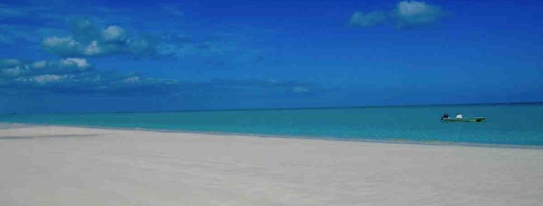 The beautiful beach and sand in front of the resort