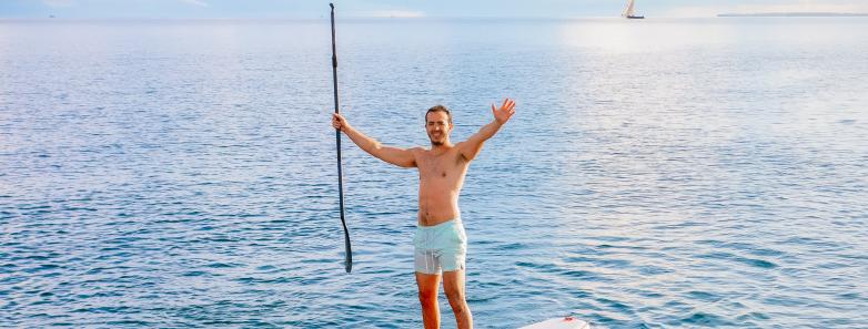 A guests paddleboarding