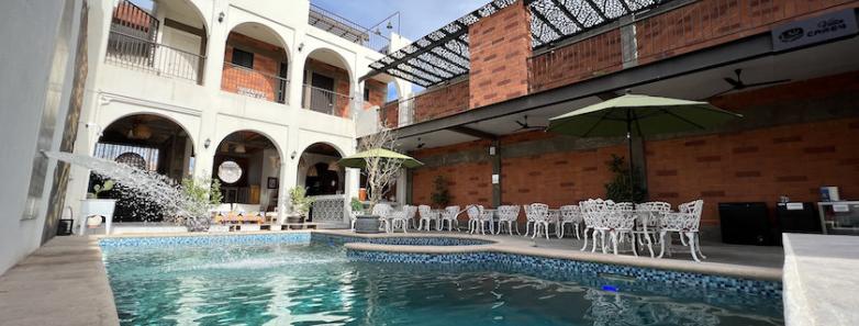 Swimming pool with building facade in the backgroun