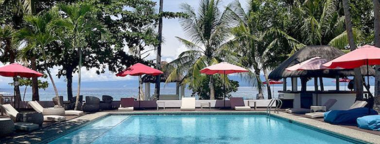 The swimming pool surrounded by tents and sunbeds