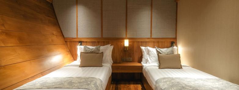 Twin beds in the lower deck stateroom