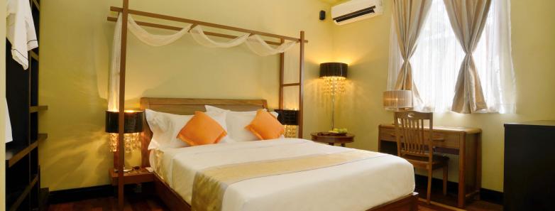 The spacious accommodations of the Deluxe Double Room