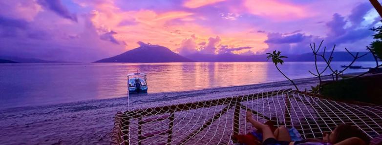 Guests enjoy the post sunset glow from a hammock