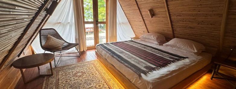 Moko Alor Villas with a large bed