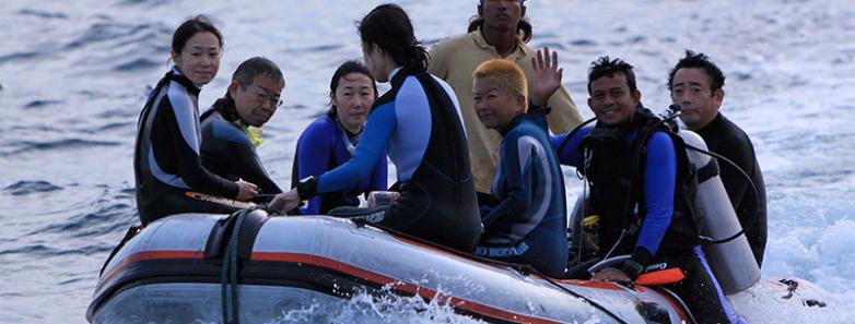 Divers in a dinghy