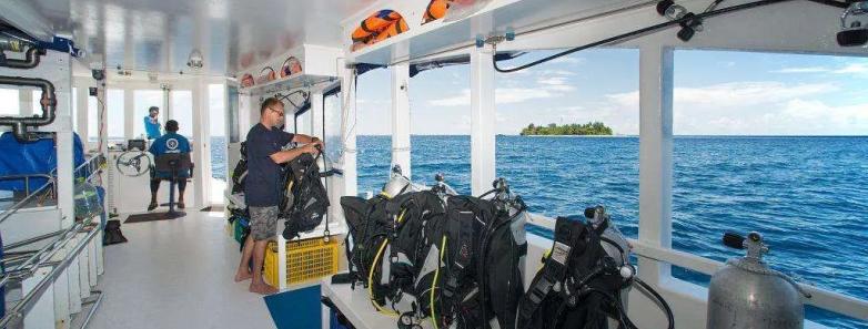 The interior of the dive dhoni with scuba gear lined up