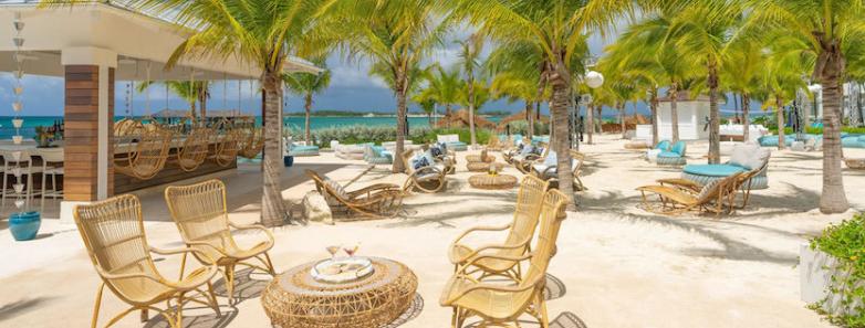 Beach chairs and tables on the sand