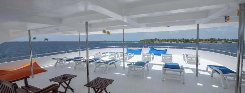 Sundeck with shaded area and many lounge chairs