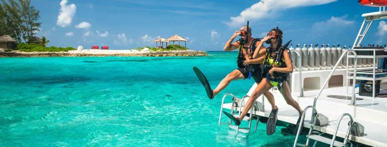 Guests take a giant stride into the ocean