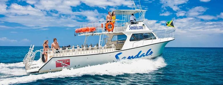 A Sandals dive boat sailing across the ocean