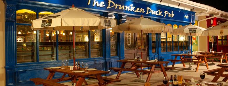 Facade of the restaurant with picnic tables outside