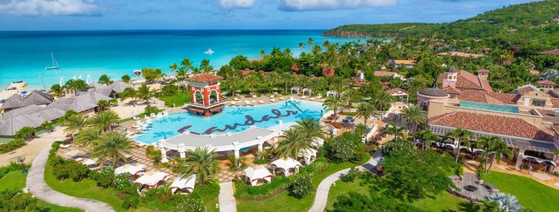 Aerial view of the Sandals Grande Antigua with a large pool in the middle