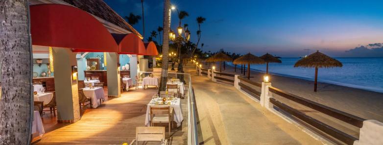 A Sandals restaurant lit up at night