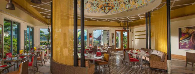 The dining area with a high ceiling