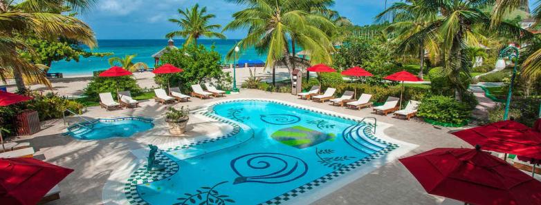 Swimming pool surrounded by red umbrellas