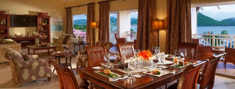 Dining table and living room area of the suite