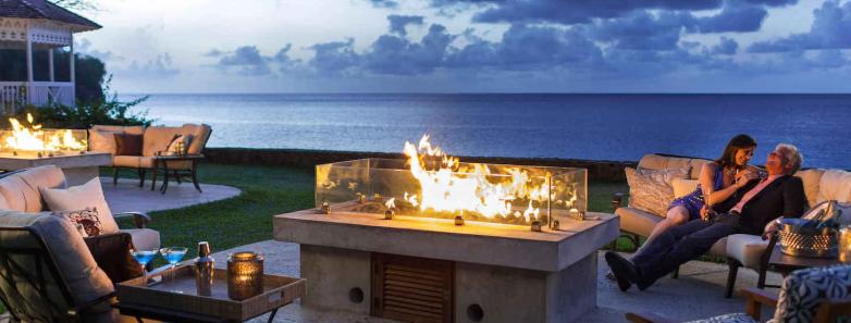 Guests relaxing around the bonfire