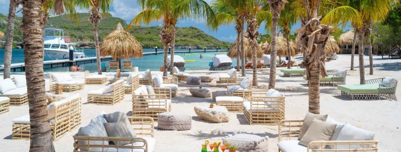 Lounge chairs and tables on the beach