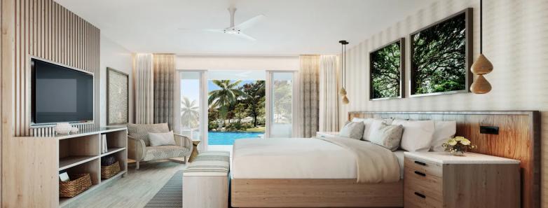 Large bed and TV of the Swim-up Suite