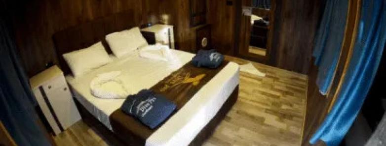 Large bed and window in the Seaview Cabin