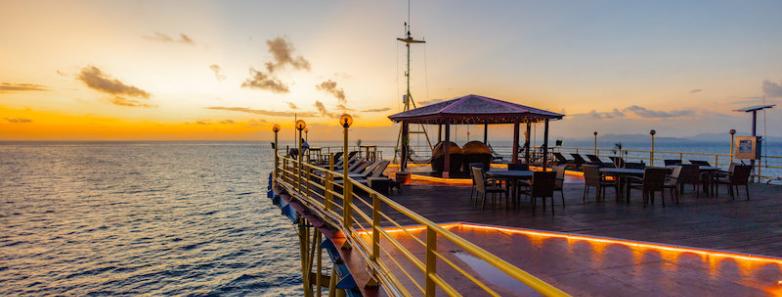 A deck where guests can enjoy the beautiful sunset