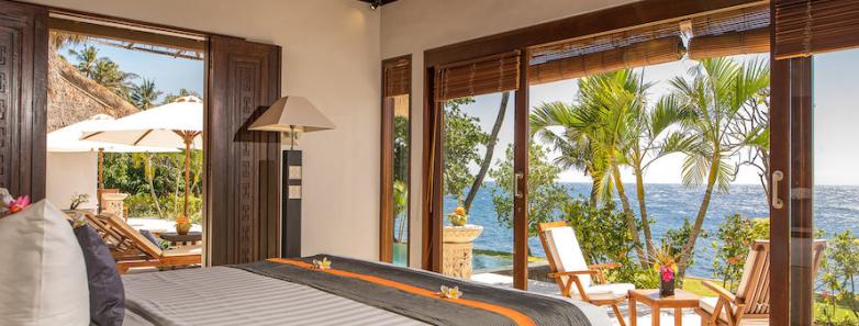 Large bed and beauttiful scenery of the Oceanfront Pool Villa