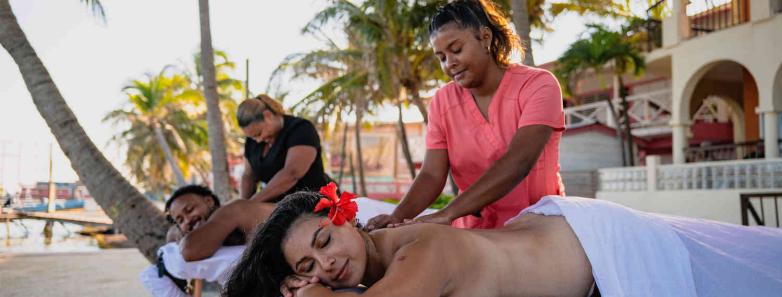 Guests having a relaxing massage by the beachfront