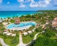 Aerial view of the Sandals Grande Antigua with a large pool in the middle